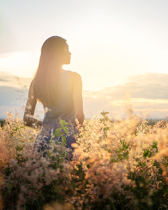 Trendy girl in stylish summer dress feeling free in the field wi OLYMPUS DIGITAL CAMERA